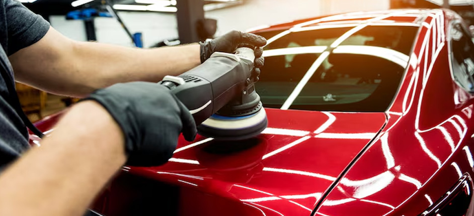 Detailer hand washing a silver crossover in an Ashburn residential driveway